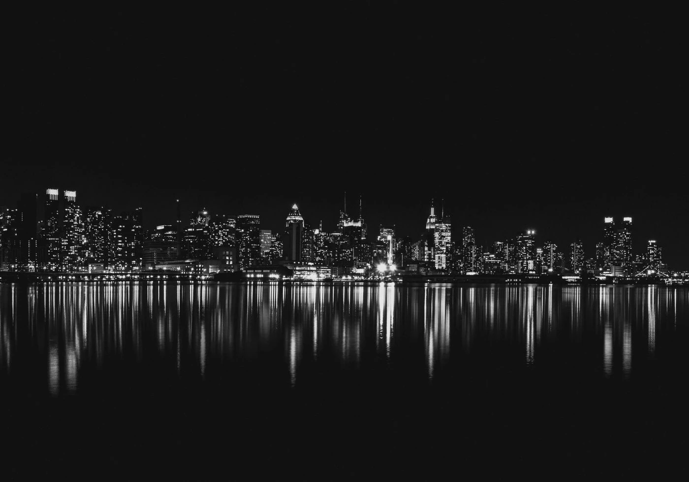 New York skyline at night — thematic stock photo, not a scene from the series